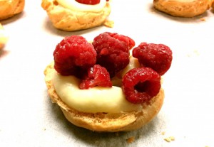 cream puff with vanilla pastry cream and raspberries