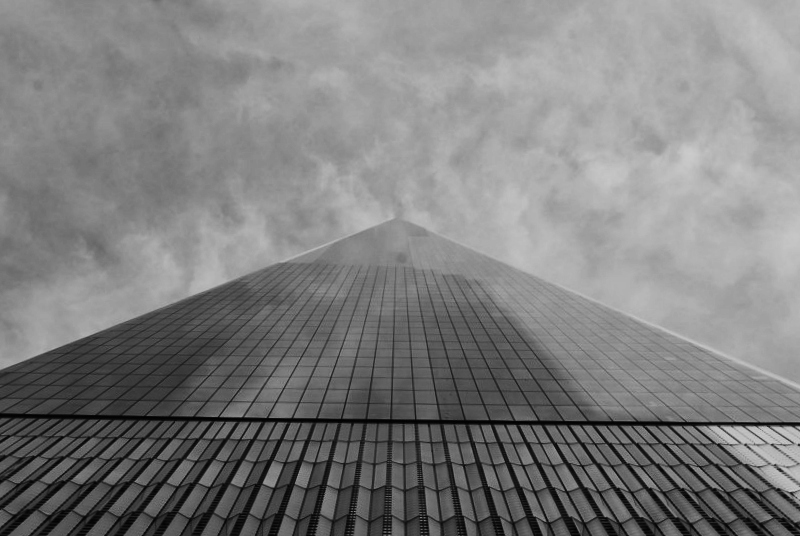 the top of a skyscraper as seen from the ground