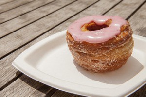 a pink icing glazed cronut