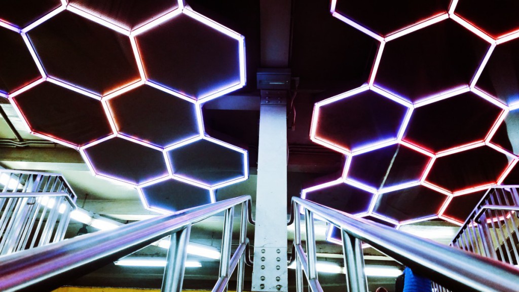 lights in a beehive pattern on a station ceiling