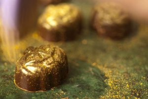 chocolate getting covered in gold luster dust