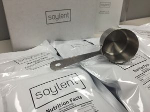 bags of soylent and a measuring cup