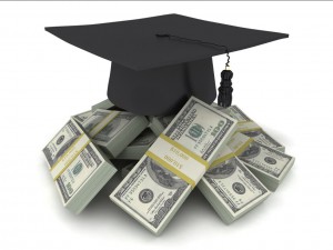 a computerized image of a graduation cap on top of a pile of cash