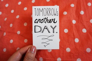 a card that says "Tomorrow's another day." 