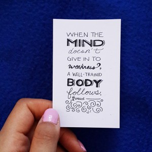 a card that says "When the mind doesn't give in to weakness, a well-trained body follows"