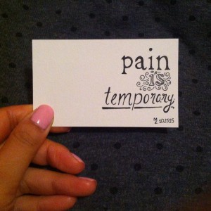 a card that says "Pain is temporary"