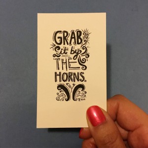 a card that says "Grab it by the horns"