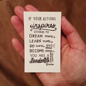 a white card with the words "If your actions inspires others to dream more, learn more, do more, and become more, you are a leader"
