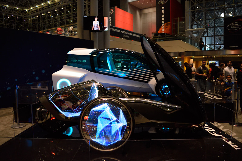 a silver sports car on display