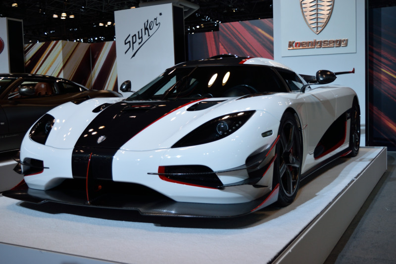 a white sports car with a black stripe down the front