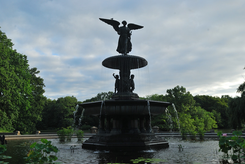 a fountain with a statue of an angel