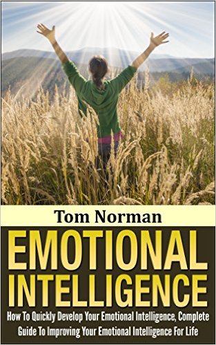 the cover of a book called "Tom Norman: Emotional Intelligence" with a photo of a woman from the back in a cornfield, her arms raised