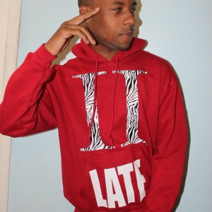 a young man in a red hooded sweatshirt
