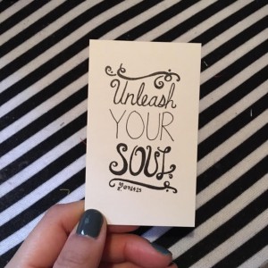 a white card that says "Unleash your soul"