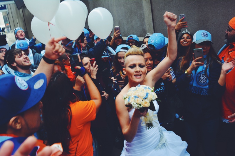 a bride with her bouquet in a crowd