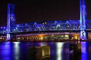 bridge over water, lit in blue