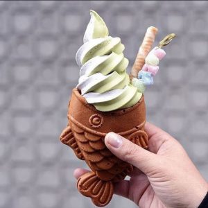 soft serve ice cream in a fish shaped waffle cone