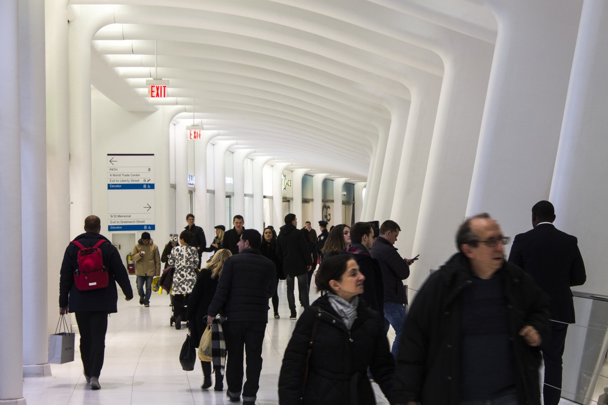 visitors in a white hallway