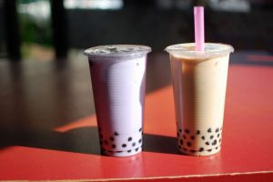 two adjacent cups of bubble tea