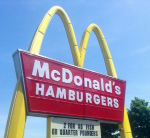 a mcdonald's sign with the famous golden arches