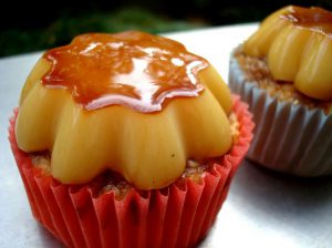 a small flan on top of a cupcake