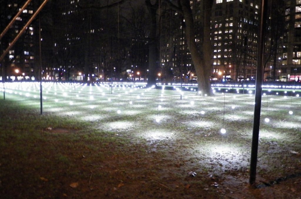 a bed of lit orbs hovering over the lawn at Madison square park