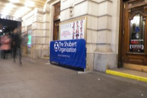 a covered barrier promoting the shubert organization