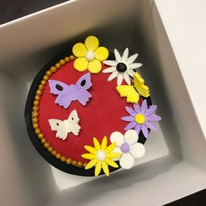 cake with fondant flowers and butterflies