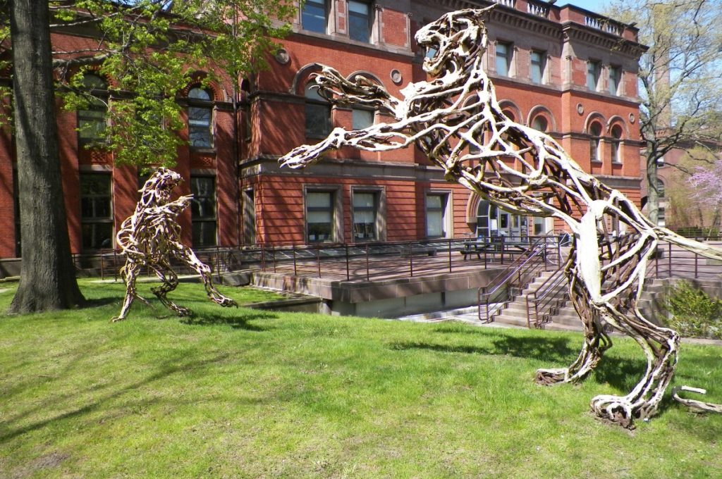 a sculpture of skeletal lions, fighting