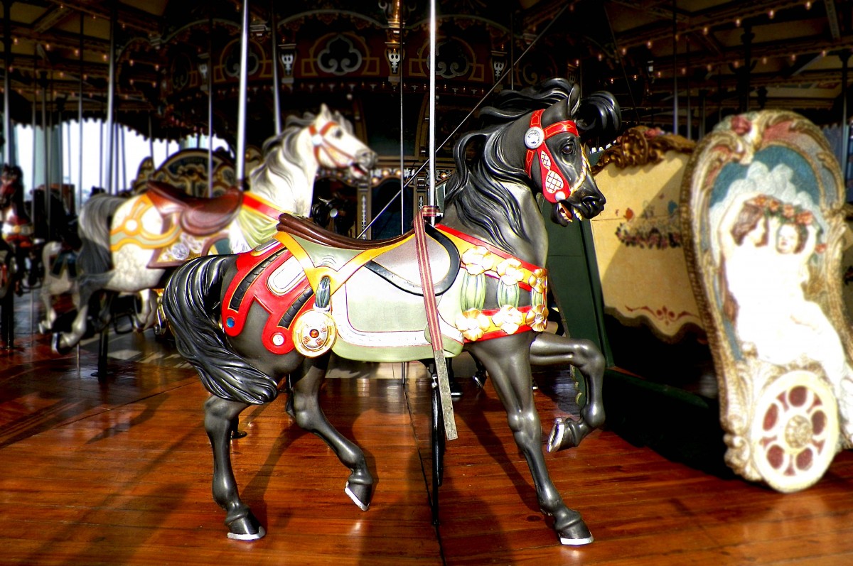 a hand carved full body image of a black horse