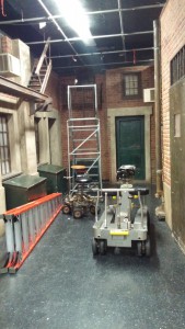 A set to look like the alleyway of the bar where the band will be shown performing through out the video along with 2 dolly's, and two ladders.