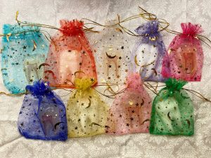 Tooth favors in holiday organza bags