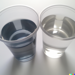 photo of two clear plastic cups side-by-side, the one on the left is half-filled with a dark gray fluid and the one on the right is half-filled with clear water
