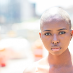 blown out portrait of young woman with a nose ring